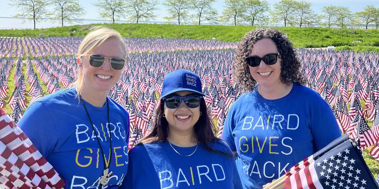  Baird associates planting flags at the Milwaukee War Memorial