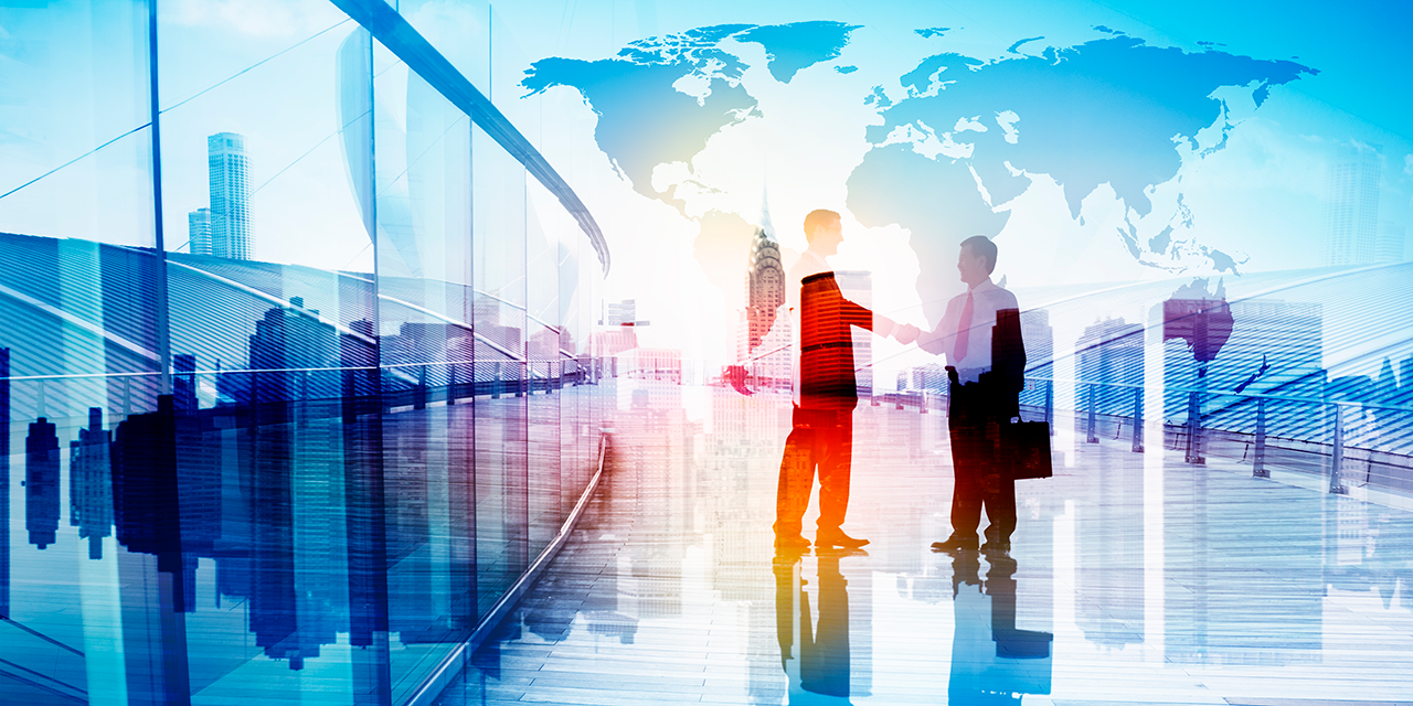 Silhouettes of Two Businessman Shaking Hands